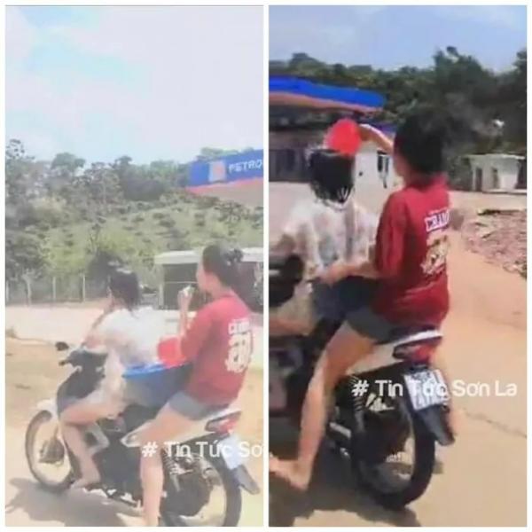Xử lý hai nữ sinh ở Sơn La vừa lái xe máy, vừa “tắm” cho nhau trên đường